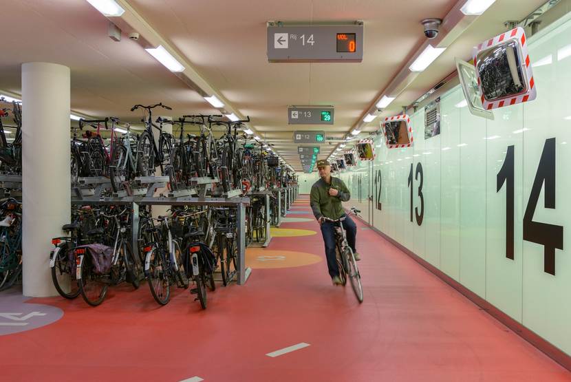 Cyclist in the bicycle garage at Rotterdam Central Station